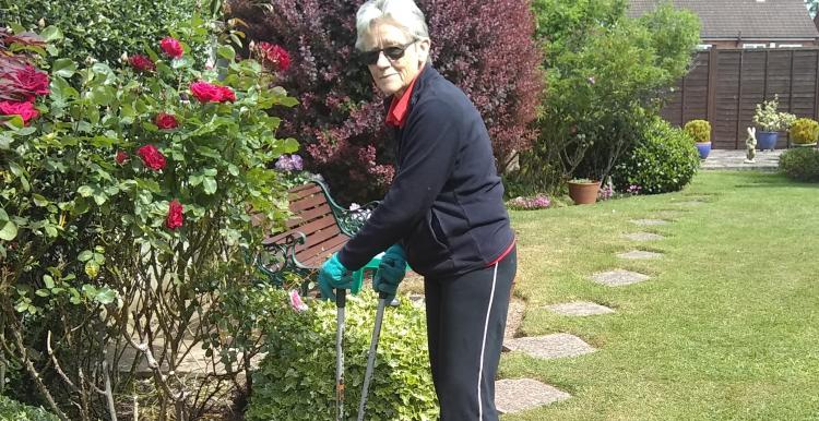 Lady outside gardening