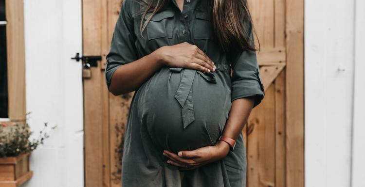 Picture of pregnant lady holding stomach