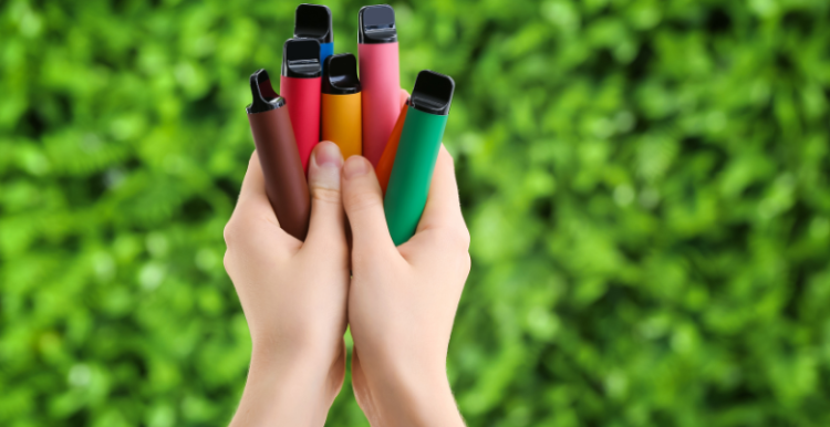 a hand holding vaping equipment