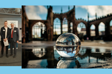 Billy Finnie receiving his certificate from Stuart Linnell with his winning image of Coventry Cathedral and its reflection in a small glass sphere.