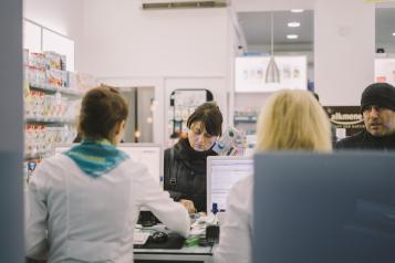 People visiting a pharmacy