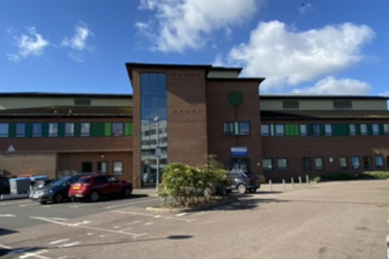 Picture of the Paybody building and its car park